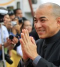 Cambodia's King Norodom Sihamoni greets officials on the first day of the annual water festival along the Tonle Sap river in Phnom Penh