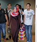 Five of 18 maids who were jailed in Malaysia arrive at Phnom Penh International Airport