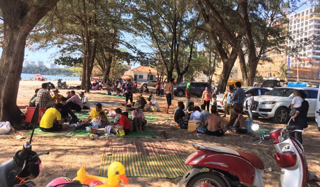 People enjoy a day at a beach in Sihanouk Province. Tourism Ministry