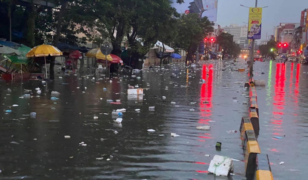 Garbage flows down Mao Tse Toung Boulevard in the capital yesterday. Facebook