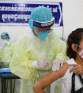 a-woman-receives-boost-vaccination-at-chroy-changvar-district-in-january.-hong-menea-copy