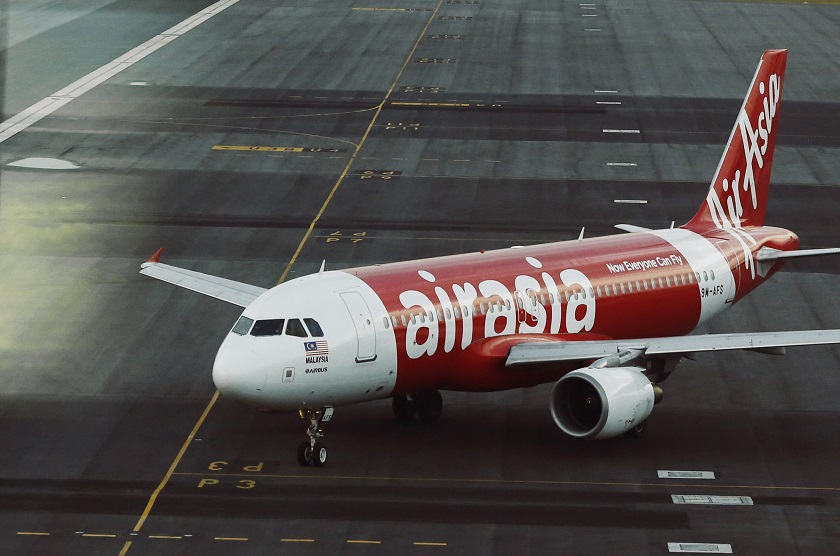 An AirAsia plane is seen on the runway at Kuala Lumpur International Airport